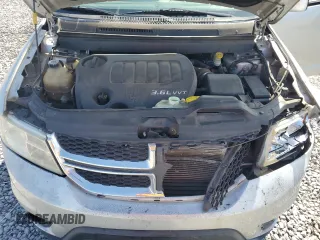 2014 Dodge Journey SXT z VIN 3C4PDCBG7ET126901, wystawiony jako Copart lot #52882625 z przebiegiem 176 923 mil mil oraz Szkoda całkowita • Salvage title. Historia ofert i sprzedaży dostępna na DreamBid. Obrazek 12.