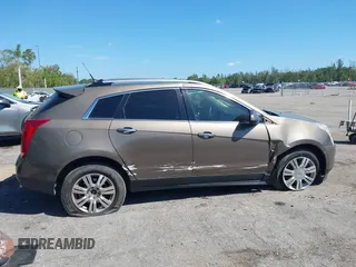 2014 Cadillac SRX Luxury Collection z VIN 3GYFNEE3XES587233, wystawiony jako IAAI lot #41747779 z przebiegiem 116 571 mil mil oraz . Historia ofert i sprzedaży dostępna na DreamBid. Obrazek 13.