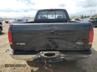 1999 Ford F-150 with VIN 1FTRX18W1XKC00918, listed as a Copart auction lot 53830305 with 205,205 mi miles and Salvage title. Bid and sale history available at DreamBid. Image 6.