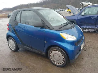 2009 Smart fortwo Pure with VIN WMEEJ31X69K312553, listed as a IAAI auction lot 41957660 with 156,476 mi miles. Bid and sale history available at carsss.com. Image 1.