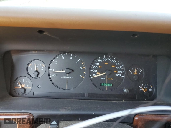1998 Jeep Grand Cherokee with VIN 1J4FX48S8WC281615, listed as a Copart auction lot 77305594 with 128,393 mi miles and Salvage title. Bid and sale history available at DreamBid. Image 9.