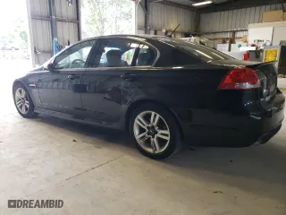2009 Pontiac G8 with VIN 6G2ER57749L228811, listed as a Copart auction lot 59982614 with 184,222 mi miles and Salvage Title. Bid and sale history available at carsss.com. Image 2.