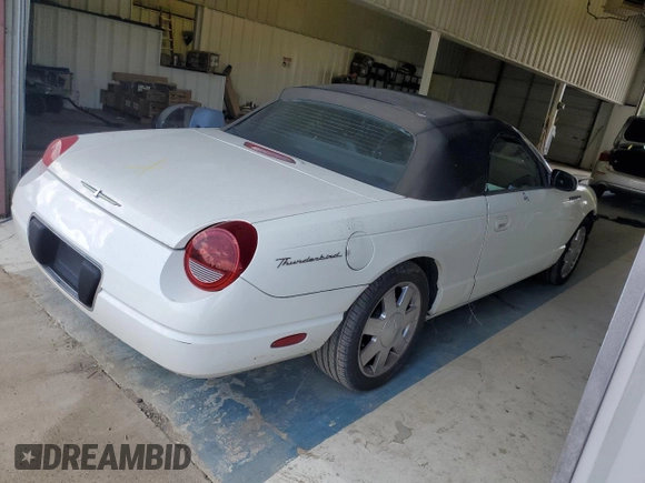2002 Ford Thunderbird Hardtop Premium z VIN 1FAHP60A52Y130277, wystawiony jako Copart lot #69473594 z przebiegiem Nie podano mil oraz Szkoda całkowita • Salvage title. Historia ofert i sprzedaży dostępna na DreamBid. Obrazek 3.