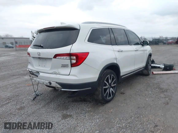 2020 Honda Pilot Touring 8-Passenger with VIN 5FNYF6H96LB056229, listed as a IAAI auction lot 41738249 with 65,099 mi miles and . Bid and sale history available at DreamBid. Image 4.