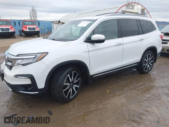2021 Honda Pilot Elite with VIN 5FNYF6H03MB044154, listed as a IAAI auction lot 41050202 with 60,331 mi miles and . Bid and sale history available at DreamBid. Image 2.