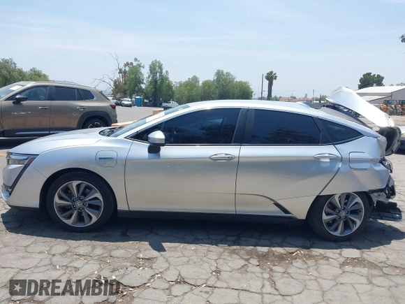 2018 Honda Clarity Touring z VIN JHMZC5F31JC021516, wystawiony jako IAAI lot #42478787 z przebiegiem 87 519 mil mil oraz . Historia ofert i sprzedaży dostępna na DreamBid. Obrazek 13.