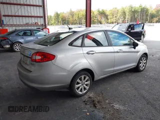 2013 Ford Fiesta SE with VIN 3FADP4BJ3DM173949, listed as a IAAI auction lot 40494276 with 141,061 mi miles. Bid and sale history available at carsss.com. Image 4.