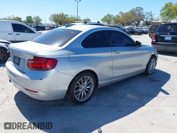 2015 BMW 2 Series 228i with VIN WBA1F5C58FV257570, listed as a IAAI auction lot 41783929 with 229,893 mi miles. Bid and sale history available at carsss.com. Image 4.