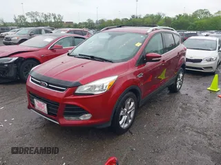 2014 Ford Escape Titanium with VIN 1FMCU0JX3EUD98815, listed as a IAAI auction lot 42078367 with 124,680 mi miles. Bid and sale history available at carsss.com. Image 2.
