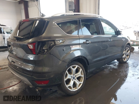 2019 Ford Escape Titanium with VIN 1FMCU9J97KUC55772, listed as a IAAI auction lot 42514001 with 77,737 mi miles and . Bid and sale history available at DreamBid. Image 4.