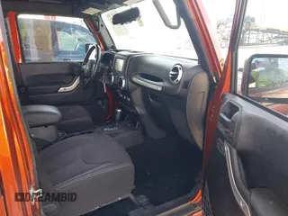 2014 Jeep Wrangler Unlimited Sahara z VIN 1C4BJWEG1EL209431, wystawiony jako IAAI lot #42325022 z przebiegiem 64 529 mil mil oraz . Historia ofert i sprzedaży dostępna na DreamBid. Obrazek 5.