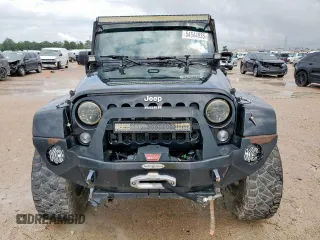 2015 Jeep Wrangler Unlimited Rubicon Hard Rock with VIN 1C4HJWFG1FL710264, listed as a Copart auction lot 54123285 with 96,737 mi miles and Salvage title. Bid and sale history available at DreamBid. Image 5.