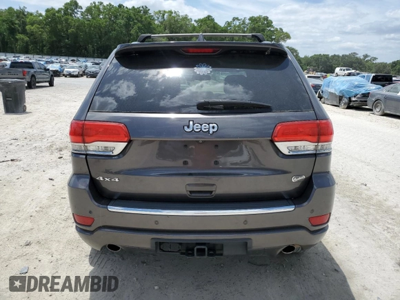 2014 Jeep Grand Cherokee Overland with VIN 1C4RJFCT7EC182234, listed as a Copart auction lot 54754465 with 185,658 mi miles and Salvage Title. Bid and sale history available at DreamBid. Image 6.