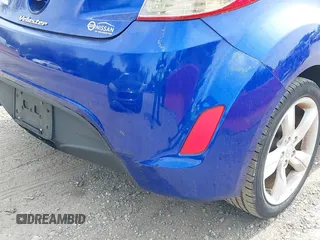 2014 Hyundai Veloster with VIN KMHTC6AD2EU184927, listed as a IAAI auction lot 42133499 with 103,499 mi miles. Bid and sale history available at carsss.com. Image 13.
