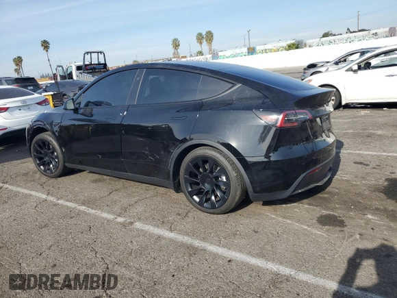 2024 Tesla Model Y Long Range with VIN 7SAYGDEE5RF060707, listed as a Copart auction lot 87288784 with Not provided miles and Salvage title. Bid and sale history available at DreamBid. Image 2.