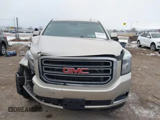 2015 GMC Yukon SLT z VIN 1GKS2BKC6FR655777, wystawiony jako IAAI lot #40982330 z przebiegiem 120 627 mil mil oraz . Historia ofert i sprzedaży dostępna na DreamBid. Obrazek 13.