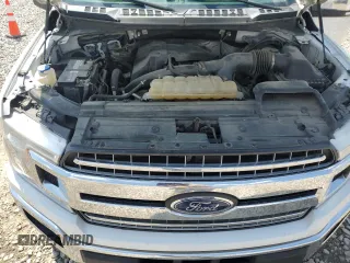 2018 Ford F-150 XL with VIN 1FTEW1EP0JFA28850, listed as a Copart auction lot 63585615 with 210,626 mi miles and Salvage title. Bid and sale history available at DreamBid. Image 11.