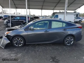 2022 Toyota Prius L Eco with VIN JTDKAMFU7N3155268, listed as a IAAI auction lot 41589024 with 158,430 mi miles. Bid and sale history available at carsss.com. Image 14.