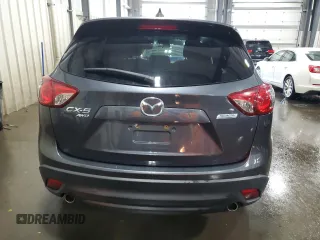 2016 Mazda CX-5 Touring z VIN JM3KE4CY5G0852073, wystawiony jako Copart lot #56599055 z przebiegiem 72 167 mil mil oraz Szkoda całkowita • Salvage title. Historia ofert i sprzedaży dostępna na DreamBid. Obrazek 6.