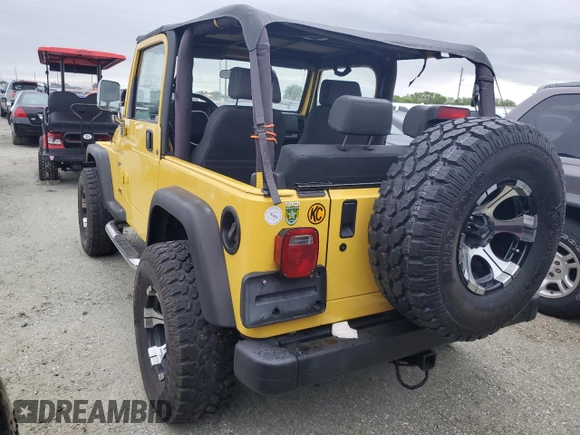 2002 Jeep Wrangler Sport with VIN 1J4FA49S12P746058, listed as a Copart auction lot 75060604 with Not Provided miles and Non Repairable. Bid and sale history available at carsss.com. Image 2.
