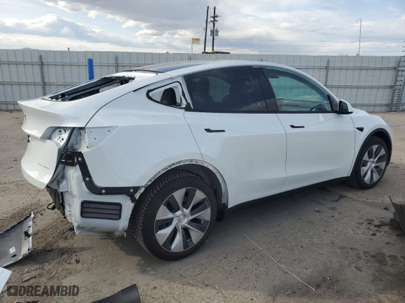 2021 Tesla Model Y Long Range with VIN 5YJYGDEEXMF299515, listed as a Copart auction lot 51978555 with 30,459 mi miles and Salvage Title. Bid and sale history available at carsss.com. Image 3.