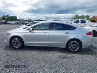 2017 Ford Fusion Titanium with VIN 3FA6P0K99HR112234, listed as a IAAI auction lot 42332700 with 106,685 mi miles and . Bid and sale history available at DreamBid. Image 14.