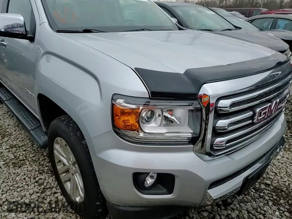 2019 GMC Canyon 4WD SLT with VIN 1GTG6DEN7K1134168, listed as a Copart auction lot 86510834 with 61,889 mi miles and Salvage Title. Bid and sale history available at carsss.com. Image 11.