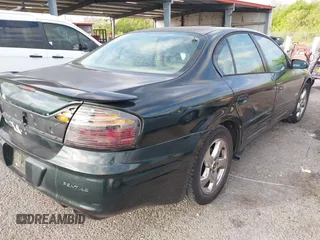 2002 Pontiac Bonneville SLE z VIN 1G2HY54K324126583, wystawiony jako IAAI lot #41939075 z przebiegiem 178 591 mil mil oraz . Historia ofert i sprzedaży dostępna na DreamBid. Obrazek 4.