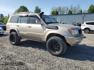 1999 Toyota Land Cruiser z VIN JT3HT05J0X0039052, wystawiony jako Copart lot #54229355 z przebiegiem 228 216 mil mil oraz Czysty tytuł • Clean title. Historia ofert i sprzedaży dostępna na DreamBid. Obrazek 4.