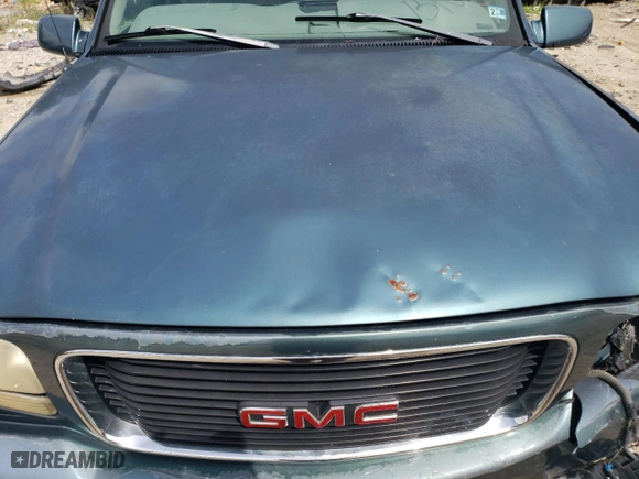 1999 GMC Denali with VIN 1GKEK13R5XR906686, listed as a Copart auction lot 64451994 with 273,180 mi miles and Salvage Title. Bid and sale history available at carsss.com. Image 12.
