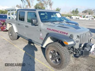 2020 Jeep Gladiator Rubicon with VIN 1C6JJTBGXLL142783, listed as a IAAI auction lot 41537444 with 98,412 mi miles and . Bid and sale history available at DreamBid. Image 1.