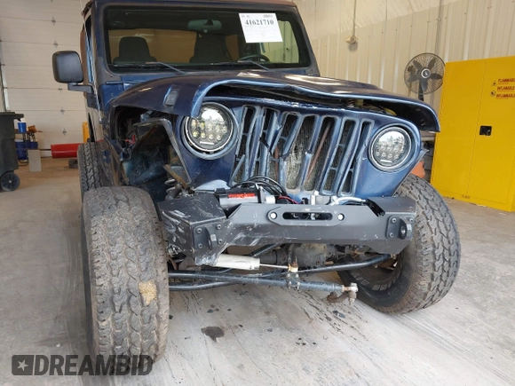 2003 Jeep Wrangler Sport with VIN 1J4FA49S53P311822, listed as a IAAI auction lot 41621710 with 156,023 mi miles. Bid and sale history available at carsss.com. Image 6.