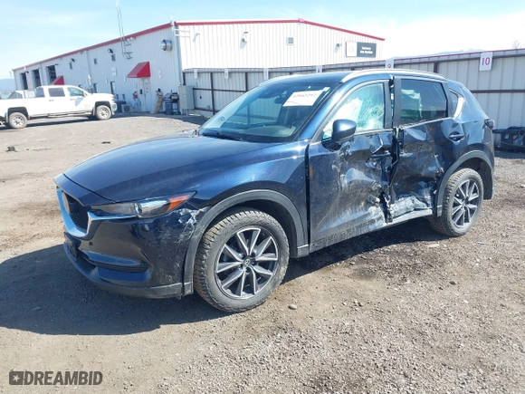 2018 Mazda CX-5 Touring with VIN JM3KFBCM5J0375070, listed as a IAAI auction lot 42043292 with 90,877 mi miles. Bid and sale history available at carsss.com. Image 18.