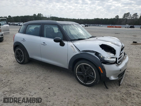 2016 MINI Countryman with VIN WMWZB3C50GWR48610, listed as a Copart auction lot 44028035 with 69,801 mi miles and Salvage title. Bid and sale history available at DreamBid. Image 4.