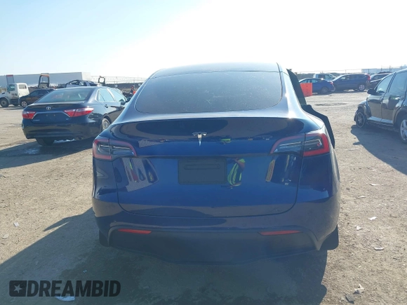2021 Tesla Model Y Standard Range with VIN 5YJYGDED5MF121874, listed as a IAAI auction lot 41238170 with 72,041 mi miles and . Bid and sale history available at DreamBid. Image 16.