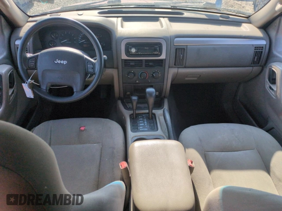 2004 Jeep Grand Cherokee Laredo with VIN 1J4GW48S54C363256, listed as a Copart auction lot 61862615 with 163,721 mi miles and Salvage title. Bid and sale history available at DreamBid. Image 8.