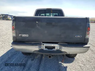 1999 Ford F-350 XL with VIN 1FTSW31S0XEC29624, listed as a Copart auction lot 70879344 with 151,680 mi miles and Salvage title. Bid and sale history available at DreamBid. Image 6.