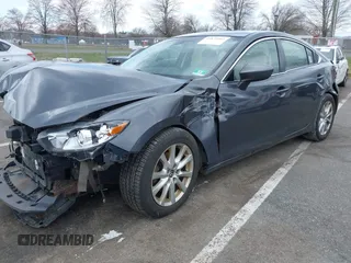 2014 Mazda 6 i Sport with VIN JM1GJ1U51E1111018, listed as a IAAI auction lot 41875461 with 253,755 mi miles and . Bid and sale history available at DreamBid. Image 2.