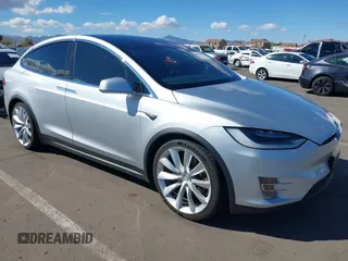2017 Tesla Model X 90D with VIN 5YJXCDE23HF053974, listed as a IAAI auction lot 41681444 with 66,712 mi miles and . Bid and sale history available at DreamBid. Image 1.