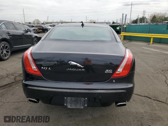 2014 Jaguar XJ Portfolio with VIN SAJWJ2GD4E8V69651, listed as a Copart auction lot 52426195 with 56,413 mi miles and Salvage title. Bid and sale history available at DreamBid. Image 6.