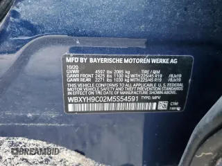 2021 BMW X2 sDrive28i with VIN WBXYH9C02M5S54591, listed as a Copart auction lot 77223834 with 0 mi miles and Salvage Title. Bid and sale history available at carsss.com. Image 12.