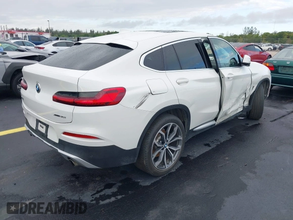 2020 BMW X4 xDrive30i z VIN 5UX2V1C02LLE68148, wystawiony jako IAAI lot #42253362 z przebiegiem 80 865 mil mil oraz . Historia ofert i sprzedaży dostępna na DreamBid. Obrazek 4.