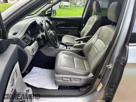 2018 Honda Pilot Touring z VIN 5FNYF6H94JB070661, wystawiony jako Copart lot #60926415 z przebiegiem 205 538 mil mil oraz Czysty tytuł • Clean title. Historia ofert i sprzedaży dostępna na DreamBid. Obrazek 14.