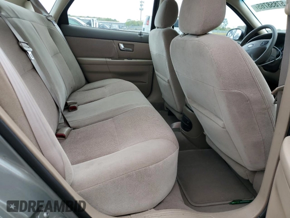 2002 Ford Taurus SE Standard z VIN 1FAFP53U92A246842, wystawiony jako Copart lot #57858765 z przebiegiem 64 545 mil mil oraz Czysty tytuł • Clean title. Historia ofert i sprzedaży dostępna na DreamBid. Obrazek 10.