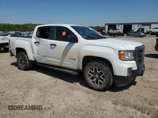 2021 GMC Canyon 4WD AT4 z VIN 1GTG6FEN5M1118081, wystawiony jako Copart lot #52452785 z przebiegiem 92 960 mil mil oraz Szkody całkowita. Historia ofert i sprzedaży dostępna na DreamBid. Obrazek 4.