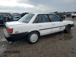 1991 Toyota Camry z VIN JT2SV21E2M3435406, wystawiony jako Copart lot #74958494 z przebiegiem 127 580 mil mil oraz Szkoda całkowita • Salvage title. Historia ofert i sprzedaży dostępna na DreamBid. Obrazek 3.