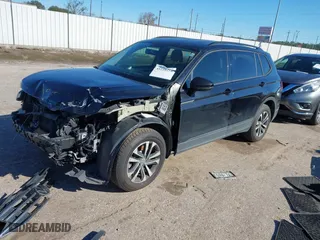 2022 Volkswagen Tiguan S with VIN 3VV1B7AX7NM107779, listed as a IAAI auction lot 41210258 with 57,154 mi miles. Bid and sale history available at carsss.com. Image 2.