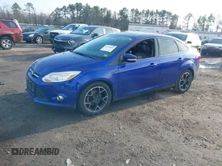 2013 Ford Focus SE with VIN 1FADP3F25DL198429, listed as a IAAI auction lot 41136019 with 123,810 mi miles. Bid and sale history available at carsss.com. Image 2.