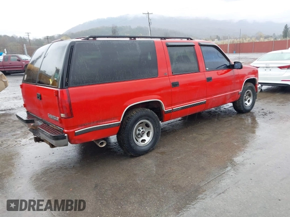 1999 Chevrolet Suburban with VIN 3GNEC16R7XG248641, listed as a IAAI auction lot 41964302 with 183,384 mi miles. Bid and sale history available at carsss.com. Image 4.