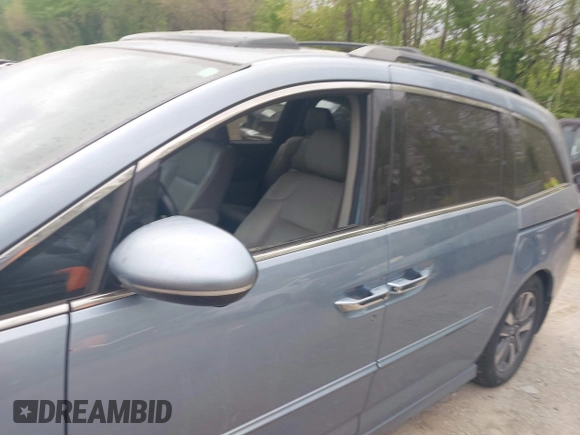 2014 Honda Odyssey Touring with VIN 5FNRL5H91EB081811, listed as a IAAI auction lot 42153920 with 16 mi miles and . Bid and sale history available at DreamBid. Image 6.